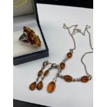 A Vintage 925 silver and amber ring, necklace and earring set.