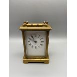 Antique brass and bevel glass carriage clock. In a working condition. Singed J.F.