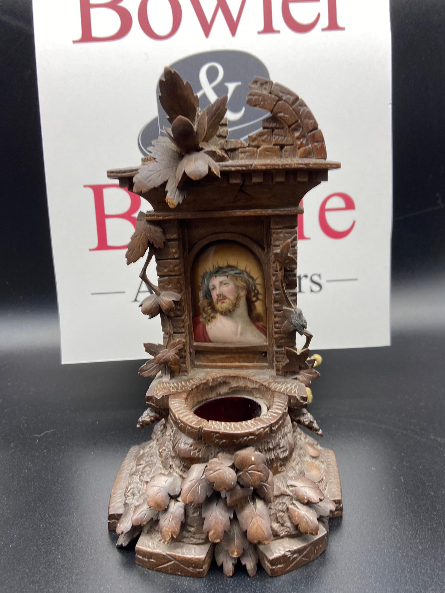 A 19th century Black Forest Holy Water font in the design of a well, designed with a hand painted