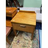 A Mid century teak pedestal side table with single under drawer.