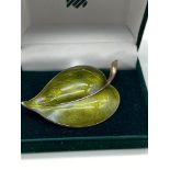 A Norwegian Sterling silver and green enamel leaf design brooch, Maker Aksel Holmsen -