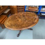 A Beautiful example of a Victorian flip top oval table. Designed with a burr walnut and inlaid
