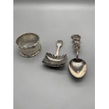 A Chinese/Japanese import silver tea spoon, Georgian silver caddy spoon and Birmingham silver napkin