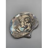 A Nice example of a WMF Art Nouveau shell shaped pin dish. Designed with a cherub whispering into