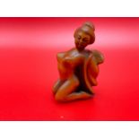 A Japanese hand carved netsuke of a nude geisha figure. Signed by the artist.