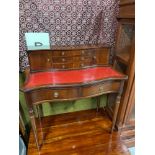 A Reproduction red leather top writing desk, designed with drawer section to the back and two