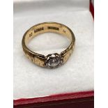 A Gent's 9ct gold ring set with a large clear stone. [Ring size O] [4.28Grams]