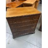 Antique four drawer chest designed with a pull out writing area.