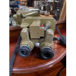 A Pair of military scope binoculars.