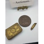 A WW1 Death plaque 'Robert McIntosh', WW1 Christmas tin and WW1 Trench art lighter.