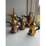 5 Various Sized Arabic coffee pots made from copper and brass.