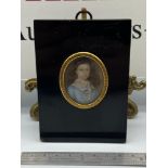 A Regency miniature portrait painting of a young gentleman. Gilt trim is engraved 'Elizabeth