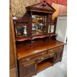 A Large impressive Irish Victorian mirror back dresser. Designed with single pedestal supports. [