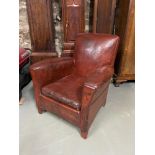 An early Victorian [Possibly Georgian] Cowhide leather club arm chair. Showing signs of stress and