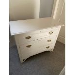 A Victorian painted three drawer chest with brass handles.