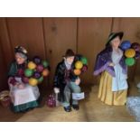 A Lot of three Royal Doulton figurines 'Balloon Lady, The old Balloon Seller & The Balloon Man'