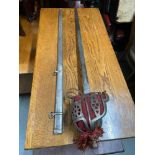 Antique Cavalry sword and scabbard, designed with an etched blade.