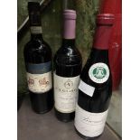 Three vintage bottles of red wine which includes Brouilly 2011, Chateau Lascombes 1996 & Barolo