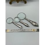 A Lot of three various hand held magnifying glasses