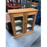 Antique stripped pine two door bookcase.