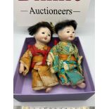 A Pair of early 1900's Asian Bisque children doll's