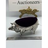 A Large Silver plated pig pin cushion. [Stamped 800 under its chin] [10.5cm length]