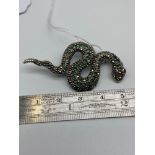 A 925 Silver, Marcasite, green and pink stone snake brooch. [5cm length]