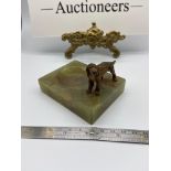 A Cold painted bronze dog figure sat upon an onyx base.