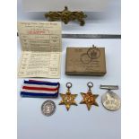 A Set of three WW2 Medals which includes the star, France & Germany Star and War medal. All with