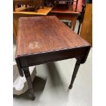 A Victorian Pembroke table with drop ends. Designed with a single under drawer and turned leg