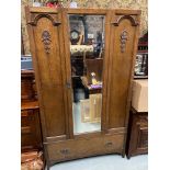 Antique oak double wardrobe designed with a single mirror front door and single under drawer. [