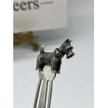 A Sterling silver novelty bookmark with a Scottie dog finial. Dog has movable head and tail.