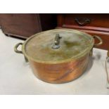 A Large ships cooking pot with lid, Made with large brass handles and copper base. [58cm wide handle