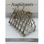 A Nice example of a silver plated toast rack of rifle form. [12x11.5x8cm]