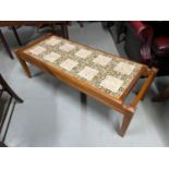 A Retro tile topped lounge table.