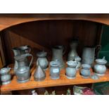 A Collection of antique pewter tankards, measures and jugs.