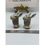 A Pair of silver plated novelty condiment pots in the form of Hare's. [6.5cm height]