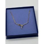 A Ladies 9ct gold and diamond necklace [.25ct diamonds] [3.39Grams]