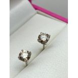A Pair of white gold [unmarked] diamond stud earrings of 77 points. [0.36ct each stud].
