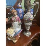 A Spanish girl and bear figurine together with a porcelain and plated claret jug