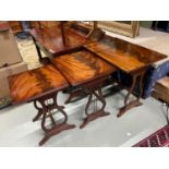 A Nest of three tables with ornate reed sides.