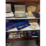 Three Shelves of collectable silver plated and E.P Cutlery which includes boxed server sets and