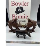 A Pair of antique hand carved figures of a child riding an ox, Together with a bronze ox figure.