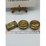 Three antique Indian snuff boxes designed with hand painted lids. All feature gilt exterior and