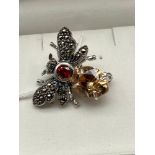 A Lovely example of a ladies silver and gem stone brooch in the form a bug. Designed with marcasite,