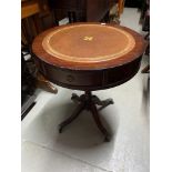A Reproduction barrel top table, designed with a single pedestal support. Finished with claw feet