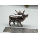 A Sterling silver figure of a Rutting Stag. [3.3cm length]