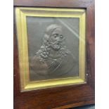 A 18th/ 19th century raised relief Jesus plaque. Fitted within a Wooden frame [24.5x23cm frame]