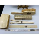 A Four piece Victorian ivory dressing table set designed with silver initials to each. Together with