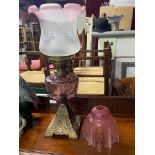 A Victorian paraffin desk lamp with Art Nouveau style shade. Together with a loose Art Deco pink